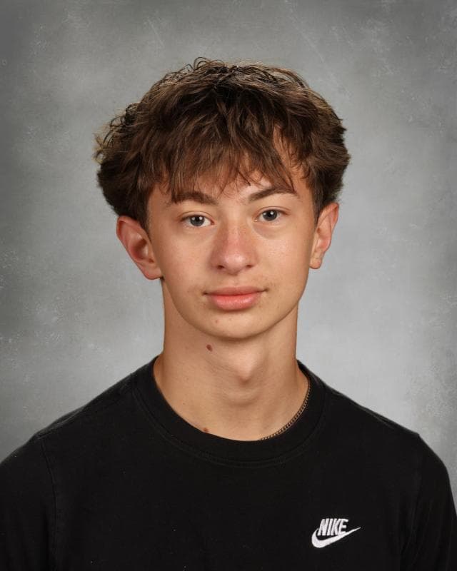 Portrait of Bently Nelson smiling with studio lighting
